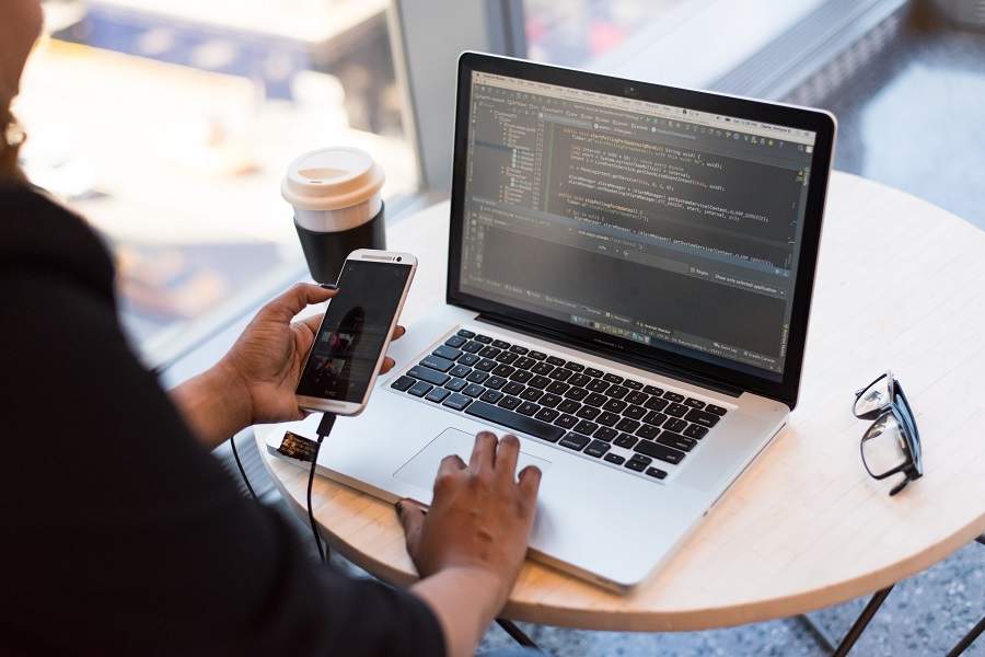 Woman coding on computer